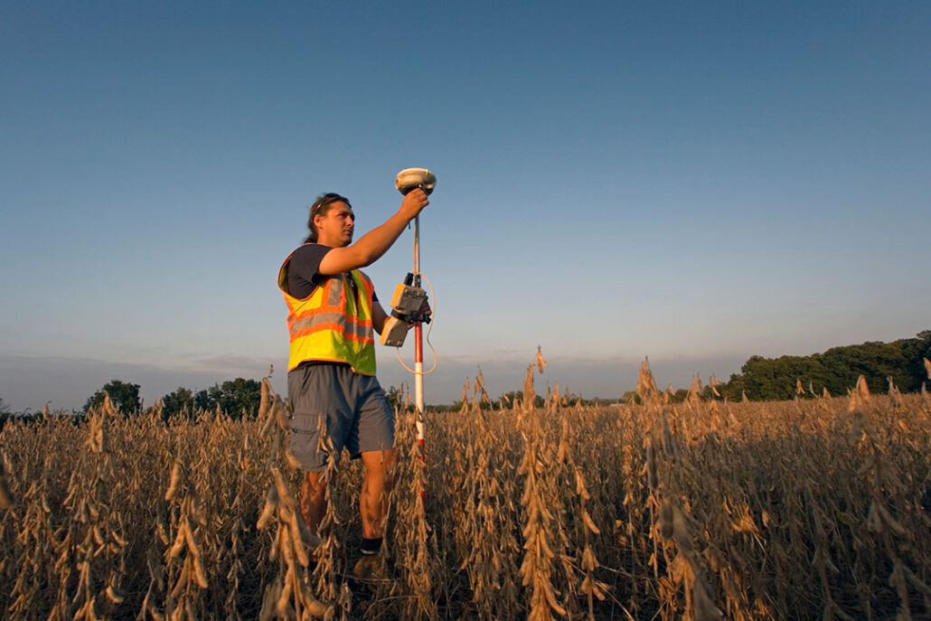 man using a handheld gps for surveying