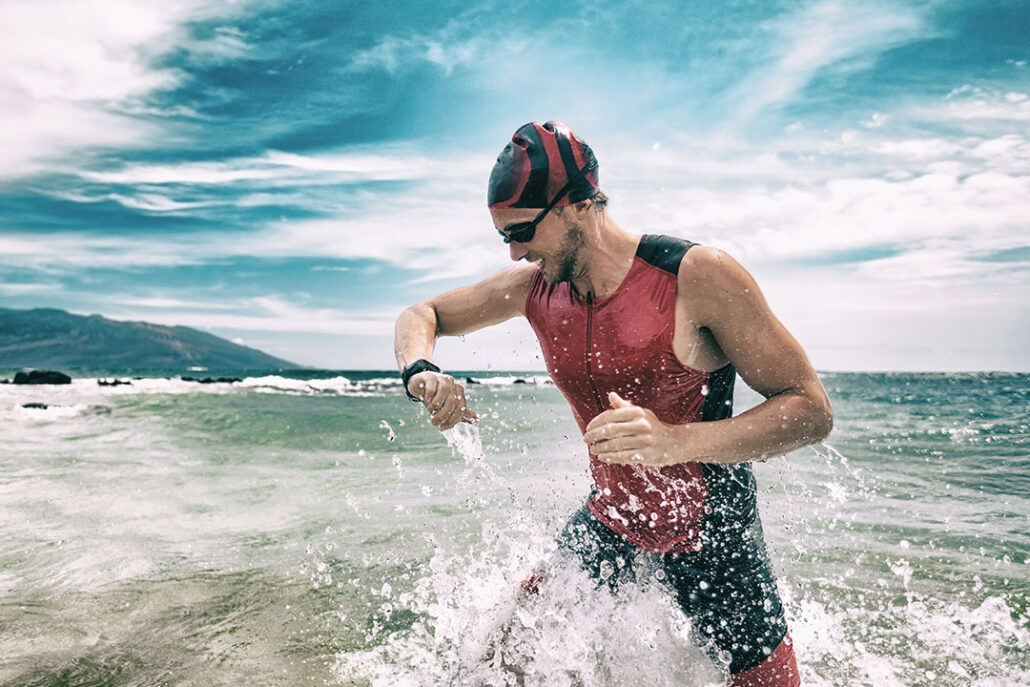 swimmer checking his gps watch