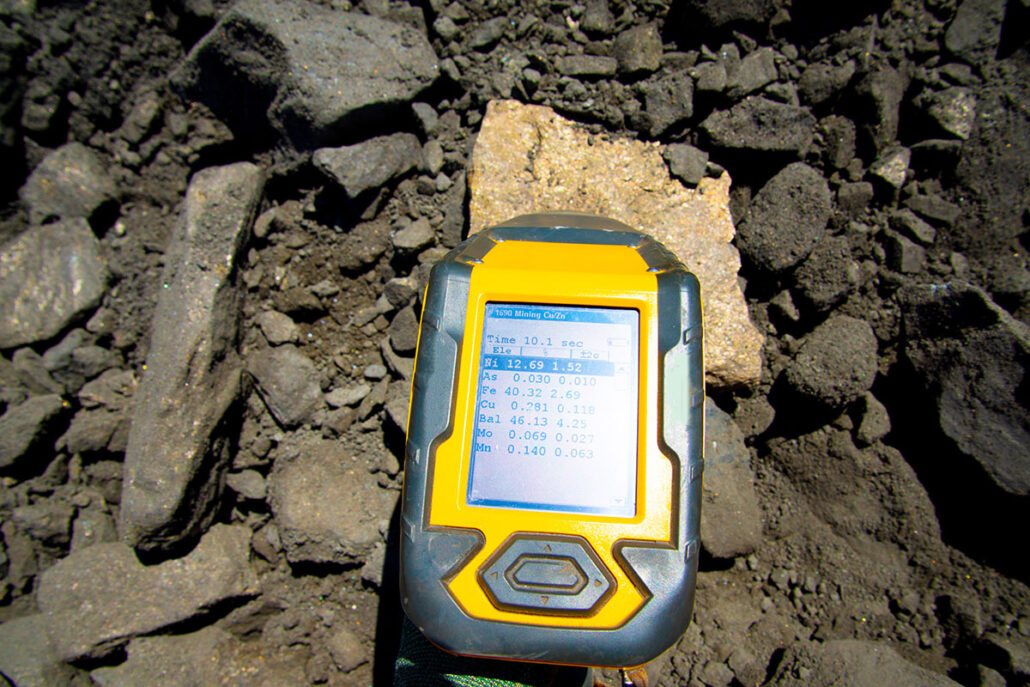 Hand-held XRF guns testing a mineral