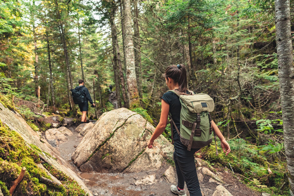 hiking in the woods with a personal locator beacon